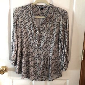 Black and white blouse with button up sleeves